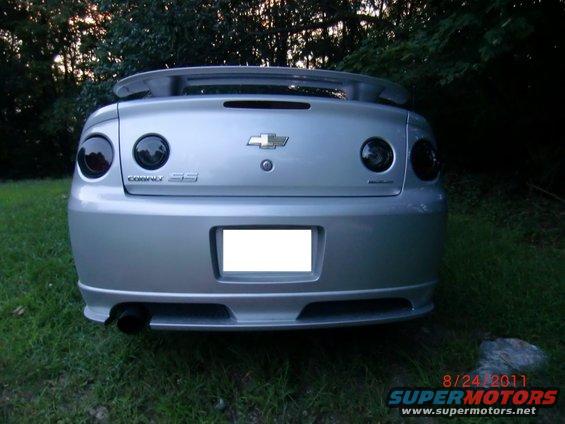 Rear view of silver 2009 Chevrolet Cobalt SS with tinted taillights and a spoiler