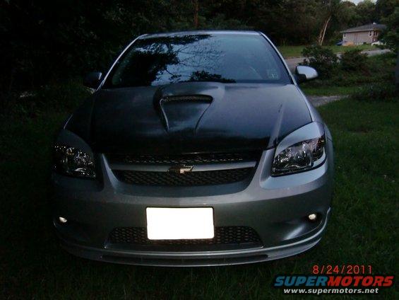 2009 Chevrolet Cobalt front view with aftermarket hood scoop and blank license plate