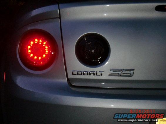 Rear of a silver 2009 Chevrolet Cobalt SS showing the taillight and emblem