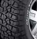 1995 Ford Bronco - Close-up of a BFGoodrich Mud-Terrain T/A tire with aggressive tread pattern and a portion of a silver alloy wheel.