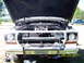 1978 Ford Bronco - This 1978 Ford F-Series truck is shown from the front with its hood open, revealing the engine compartment. A California license plate is v…
