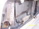 1978 Ford Bronco - The image shows a close-up view of a vehicle's radiator and an attached transmission cooler, with visible hoses and mounting brackets.