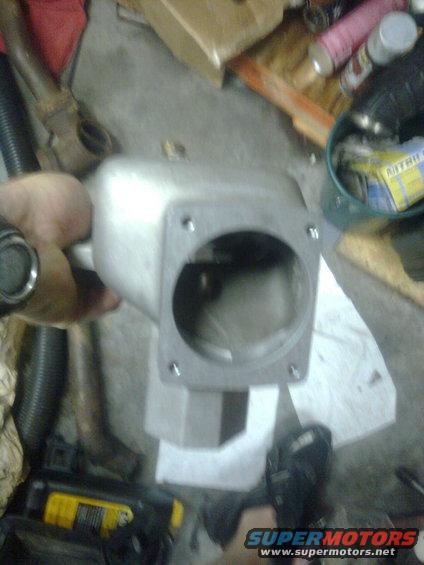 image0061.jpg This is the piece for the t-body they want me to use from the factory...Its for a factory t-body.