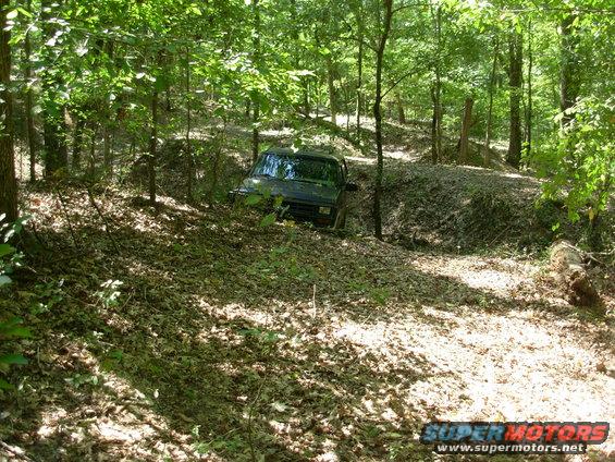 110828stuck7.jpg Last Saturday evening, we decided to make a quick run before it rained.  But just as I got down in this hole, it started to sprinkle, and I got a little too anxious to get out, and blew the LHF hub lock.  Rather than make a mess, I just left it until today.