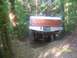 1989 Ford Bronco - 1989 Ford Bronco navigating a wooded trail with orange markers on trees.