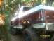 1989 Ford Bronco - This lifted Ford Bronco is navigating a muddy, wooded trail with a date stamp of 01/01/2008.