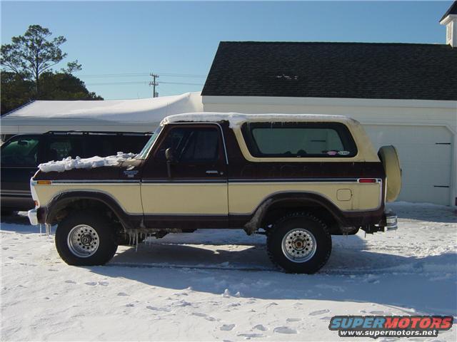 Side view of a 1979 Ford Bronco in the snow