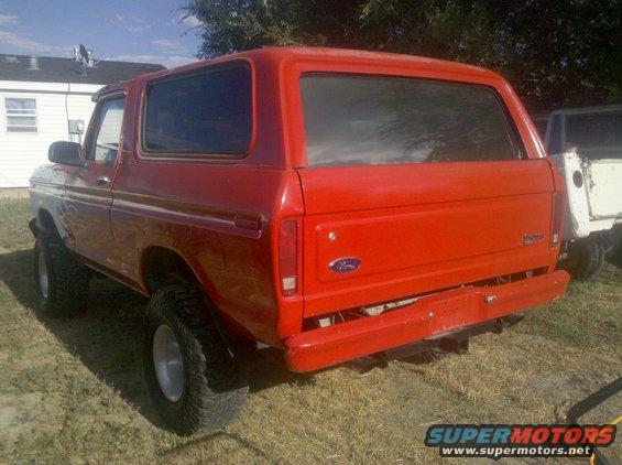 Red 1979 Ford Bronco, rear quarter view
