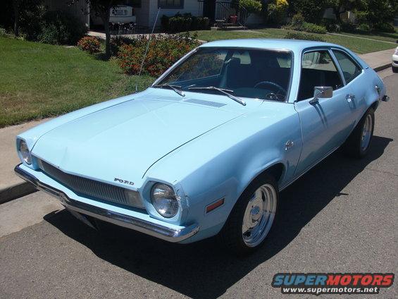 Light blue 1972 Ford Pinto parked on a residential street, front 3/4 view