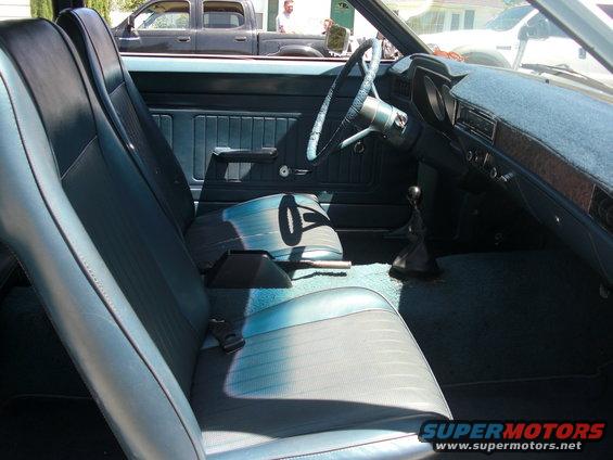 1972 Ford Pinto interior showing front seats, dashboard, and steering wheel