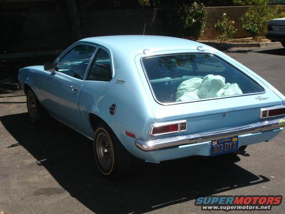 Light blue 1972 Ford Pinto hatchback parked on street, rear view. California license plate 303 DYX