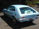 1972 Ford Pinto - Rear view of a light blue 1972 Ford Pinto hatchback with items in the back seat.