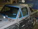1972 Ford Pinto - Ford Bronco II undergoing bodywork, with windows taped for protection.