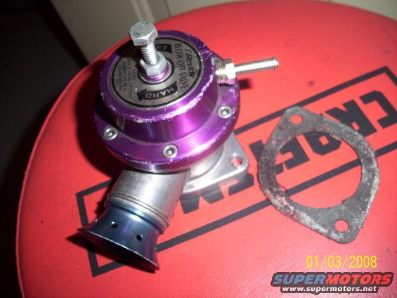 Purple blow off valve with "BLOW OFF VALVE" text and a metal gasket