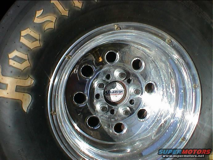 dsc00066.jpg Strange 35 spline axels with 4.75 bolt pattern (Chevy) with 5/8 studs. I drilled new holes in brake drums These Weld Draglite's have a 4.5 and 4.75 pattern. Not much call for drag rims valve stem hole in the middle for (tubes) For Ford truck 5.5