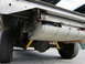 1987 Dodge 1500 - Undercarriage view of a truck, focusing on the fuel tank and rear suspension components.
