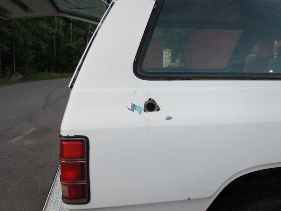 1987 Dodge 1500 rear quarter panel with damage and a hole