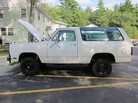White 1987 Dodge Ramcharger side view with hood open