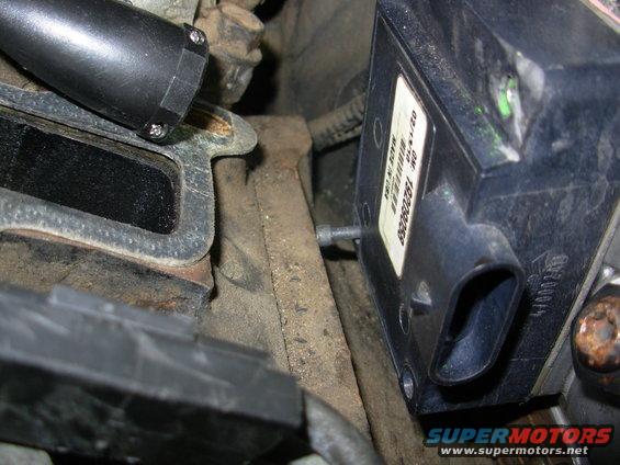 The bottom screws can't come out with the PMD in-place, so do them first.  If you can't get them, there's no need to remove the top screws.

Cover the intake ports on the heads so nothing can fall inside.  I was lucky.