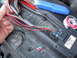 There's clear heat-shrink on the pink wire, and blue on the green wire.  Note the staggered cuts tha...