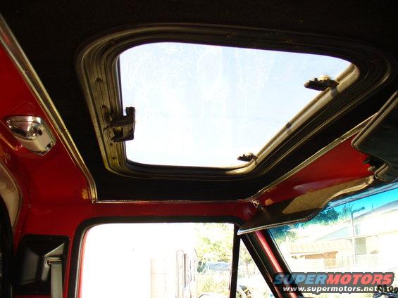 1979 Ford Bronco interior showing sunroof and red trim