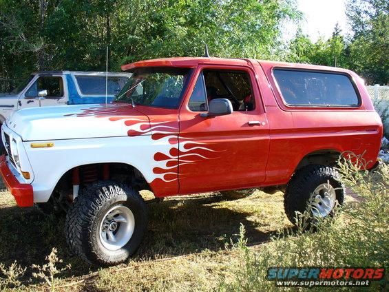 Red and white 1978 Ford Bronco with flame decals, 3q-front view