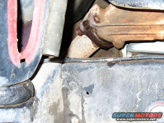 close-up of rusty exhaust manifold and pipe connection