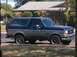 1990 Ford Bronco - Side view of a two-tone blue and gray 1990 Ford Bronco.