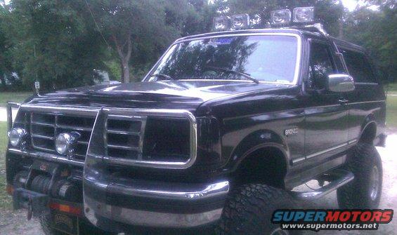 Black Ford Bronco with off-road lights on roof and brush guard