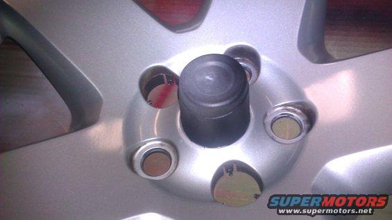 I wanted to keep the faux center cap silver.  I have two kids, so, I could't find my painters tape.  I cut the lip of a small rubbermaid container that fit perfect.