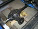 1992 Ford Bronco - A black rear axle differential assembly is shown, mounted within a vehicle's frame and connected to leaf springs.