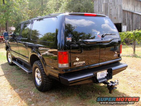 Rear view of a black 2005 Ford Excursion with a Texas license plate that reads HOOEY