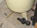 1993 Ford F-250 - Close-up of an air compressor tank's drain valve and several rubber mounting components on a concrete floor.