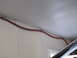 1993 Ford F-250 - Red conduit runs along the ceiling and wall, secured with zip ties.