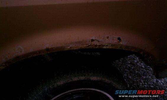 Drivers side rear fender rust, common to Fords of this model year.