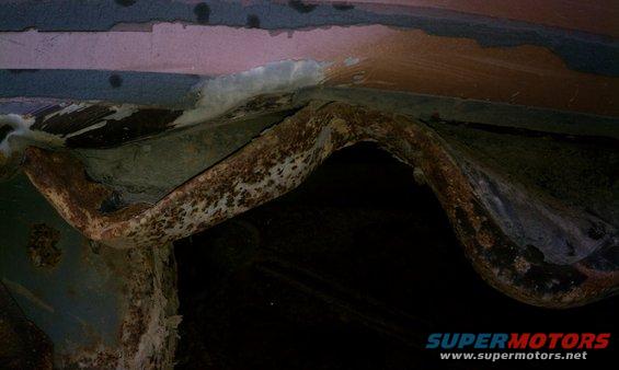 Rear drivers side panel with damage from being pulled out of a ditch, hydro planed off-road.