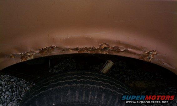 Rear drivers side rust, common to Fords of this model year.