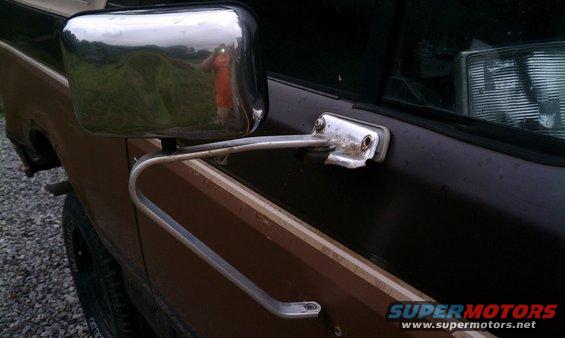 Passenger side mirror missing bolts.