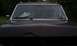 1990 Ford Bronco - Front view of a dent in the hood due to an encounter with a tree.