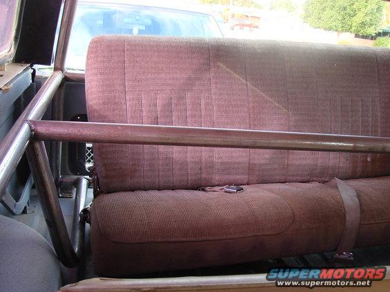 Interior roll cage and rear seat of a 1979 Ford Bronco