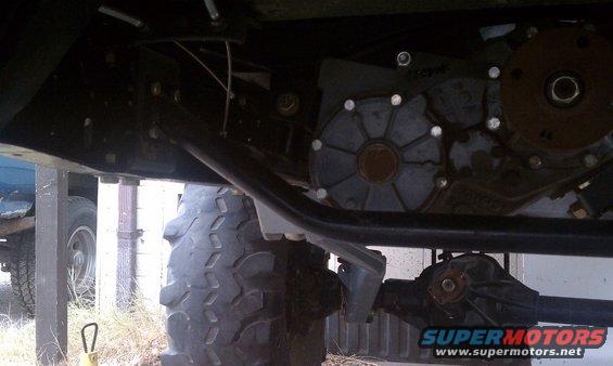 Undercarriage of a vehicle with large tire, transfer case, and differential visible