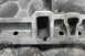 1997 Ford Ranger - Close-up of an aluminum intake manifold with machined ports, showing signs of wear and debris.