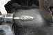 1997 Ford Ranger - A close-up view of a rotary burr tool in action, grinding metal and creating debris.