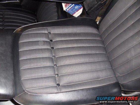 1969 Chevrolet Camaro interior with patterned seats and an ACDelco box
