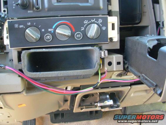 usb4.jpg I took apart a cigar socket USB adapter & found the guts fit here perfectly.  So I soldered some wires on, but I haven't found the switch I want yet.  Eventually, I'll be able to turn the USB power off, on, or set it to be controlled by the key.  For now, I'll just solder its power wire to the key-switched feed.

I'm doing some other mods at the same time, which is why there are more wires.

[url=http://www.supermotors.net/registry/media/1023301][img]http://www.supermotors.net/getfile/1023301/thumbnail/48jacks1.jpg[/img][/url]