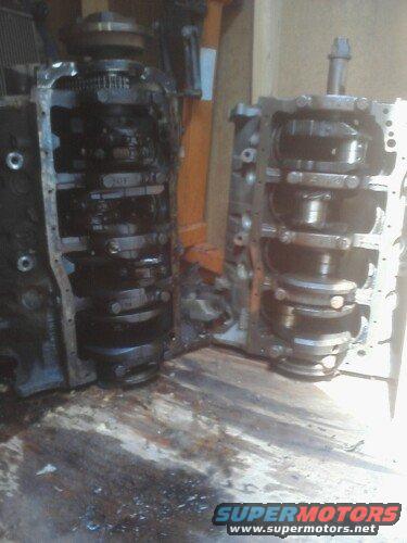 Two disassembled engine blocks with crankshafts visible, one on the left and one on the right