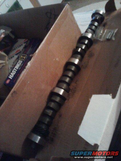 Camshaft with Hastings piston rings box in background