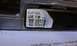 1992 Ford Bronco - Close-up of an electronic control unit with a label containing part numbers and a barcode.