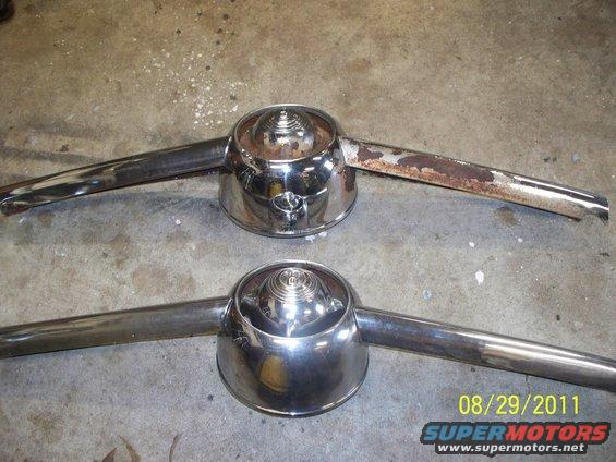 Two chrome trim pieces with central domes, one showing rust damage