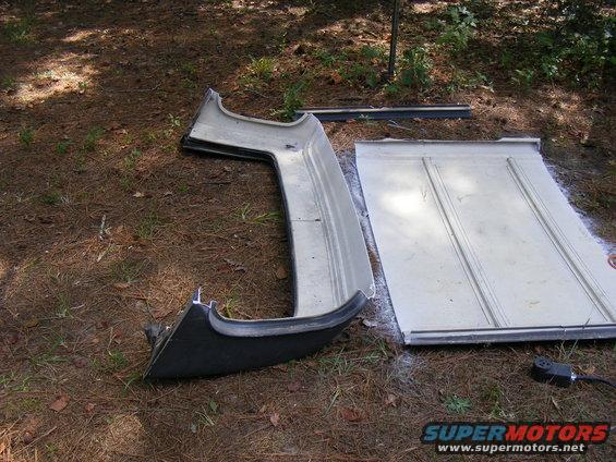 Car hardtop and door panel on the ground